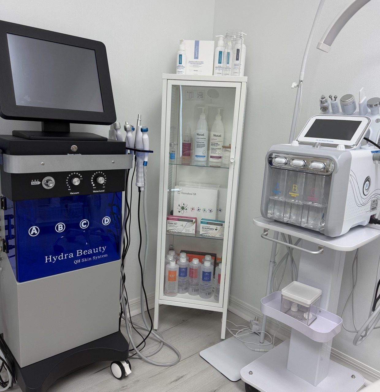 Hydra Beauty hydro-dermabrasion unit and product shelf in the treatment room